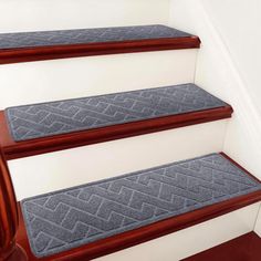 carpeted stair treads on the side of a staircase