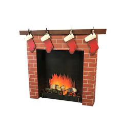 a brick fireplace with stockings hanging from the mantel and fire logs on either side