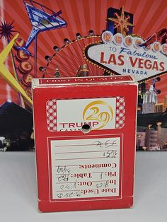 a red box that is next to a sign with las vegas in the back ground