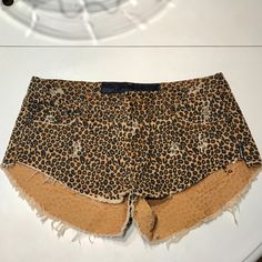 Animal Print (Cheetah/Leopard) Cutoff Denim Shorts. High Waisted With Longer Fabric In The Back Of Leg And Shorter In The Front. Button Fly With 5 Pockets And Black Hardware. Ripped Detailing Throughout And No Noticeable Wear Except For On The Inside Of The Garment (Pilling On Inside Of Pocket Pictured). Teaspoon Shorts, One Teaspoon Shorts, 2024 Aesthetic, Shorts High Waisted, Cutoff Shorts, Denim Cutoff Shorts, One Teaspoon, Black Hardware, Cut Off Shorts