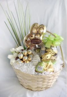 a basket filled with lots of different types of chocolates and candies in it