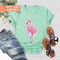 "Watercolor Flaming Shirt, Women's Flamingo Shirt, Flamingo Tee, Flamingo Gift, Flamingo Gift for Women, Flamingo Lovers, Flamingo Shirt Gift BLACK TEXT is used by for Yellow, Heather Peach, White, Light Gray Heather Shirts. WHITE TEXT is used by Other Colored Shirts. Hi! Welcome. It's great to see you here! ☺️  Our shirts are clean, high quality and soft. It is prepared quickly by our boutique.  Ironing and shipped.  Enjoy your shopping!  It is a pleasure for us to help you with your questions Summer Pink Flamingo Print Top, Casual Flamingo Print Tops For Spring, Casual Spring Tops With Flamingo Print, Pink Flamingo Print T-shirt For Summer, Summer Cotton Tops With Flamingo Print, Summer Cotton Top With Flamingo Print, Casual Summer T-shirt With Flamingo Print, Casual Flamingo Print T-shirt For Summer, Casual T-shirt With Flamingo Print For Summer