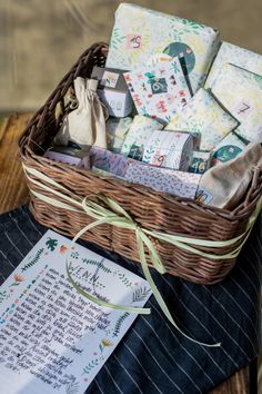 a wicker basket filled with cards and papers