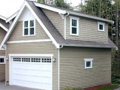 a house with two garages in front of it