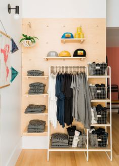 an organized closet with clothes and shoes