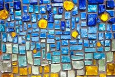 a blue and yellow mosaic design on canvas