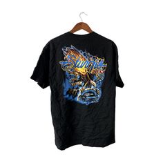 a black t - shirt with an image of a dragon on the front and back