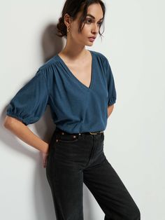 Not your boyfriend's v-neck. Shirred cuffs and front and back yoke give it that relaxed vibe, with a subtle balloon sleeve for a feminine twist. (This one comes in Midnight Navy). | Edie Top in Midnight Navy | Ethical Essentials Navy Classic Top With Relaxed Fit, Classic Fitted Indigo Top, Indigo Tops Pre-washed Relaxed Fit, Indigo Top, Light Indigo Relaxed Fit Button-up Top, Indigo Relaxed Fit Button-up Top, Blue Shirt Women, Nation Ltd, Deep Indigo