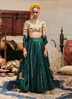 An exquisite creation, this lehenga in luxurious raw silk fabric is paired with a stylish zero neck matching blouse featuring three-fourth sleeves adorned with intricate mirror work. Complementing the outfit is a delicate organza dupatta (Optional: green or blue dupatta) that adds a touch of elegance and grace. Perfect for special occasions, this ensemble beautifully balances tradition and modern sophistication. Green Palazzo Set With Unstitched Blouse For Wedding, Green Organza Dress With Cutdana, Green Organza Dress With Cutdana Detailing, Green Silk Cutdana Sets, Green Chanderi Set For Reception, Designer Green Choli With Sheer Dupatta, Festive Green Art Silk Palazzo Set, Designer Green Lehenga With Sheer Dupatta, Green Sets With Zari Work For Reception