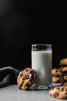 chocolate chip cookies and milk on a table