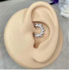 a pair of ear piercings sitting on top of a table