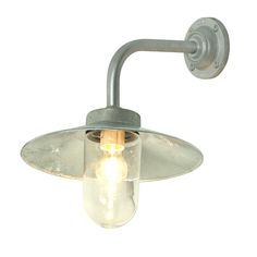 a light that is on the side of a white wall mounted fixture with a bulb attached to it