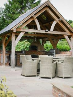 an outdoor dining area with wicker furniture