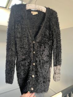 Black and gold sparkly cardigan, fits size S Chic Winter Party Cardigan, Chic Winter Cardigan For Party, Glamorous Fitted Cardigan For Winter, Glamorous Long Sleeve Winter Sweater, Glamorous Winter Cardigan For Night Out, Glamorous Fall Sweater For Night Out, Glamorous Winter Sweater For Night Out, Fall Party V-neck Sweater, Fall Party Knit Cardigan