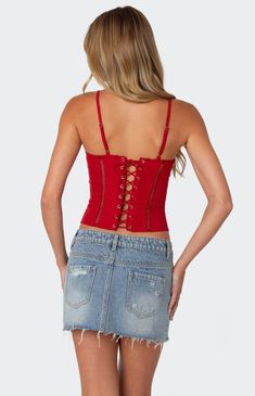 Online only! Turn heads with the Jennie Ladder Knit Corset from Edikted, boasting adjustable straps and a flattering cupped construction for a perfect fit. Adorned with intricate ladder knit detailing and a sultry lace-up back closure, this corset combines chic style with undeniable allure for a look that commands attention.


	Corset
	Adjustable straps
	Cupped construction
	Lace up back closure
	Ladder knit detailing
	Polyester, Spandex
	Model wears size S
	Model height is 5'8
	Item care: Wash with similar color Trendy Red Crop Top With Built-in Bra, Fitted Red Crop Top With Straps, Red Fitted Tank Top With Adjustable Straps, Red Fitted Top With Adjustable Straps, Red Cami Top With Adjustable Straps, Red Fitted Tops With Adjustable Straps, Fitted Red Tops With Straps, Red Tank Top With Adjustable Straps, Knit Corset