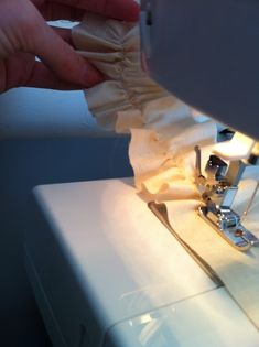 someone is using a sewing machine to sew something