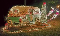 a trailer decorated with christmas lights and decorations