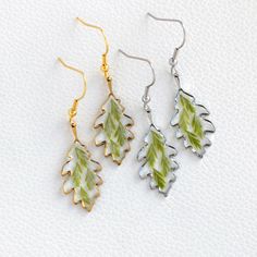 Real Green Leaf Resin Earrings, Handmade Real Leaf Earrings | Minimalist Leaf Earrings | Christmas Gift | Unique Birthday Gift | Gift for Her 🌿Adorn yourself with the exquisite beauty of nature with our Real Green Leaf Resin Earrings. Each pair is meticulously handcrafted, combining the elegance of real leaves with the timeless charm of resin. These earrings are the perfect accessory to add a touch of natural elegance to any outfit, making them an ideal gift for any occasion. 🌿Highlights:  - D Leaf-shaped Earrings As Gift, Leaf-shaped Earrings For Gift, Resin Leaf Earrings, Green Leaf-shaped Earrings For Gift, Handmade Green Leaf-shaped Jewelry, Real Green, Real Leaf, Unique Birthday Gift, Real Leaves