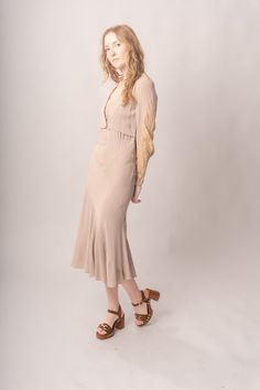 Stunningly preserved 1920’s mauve & ecru bias cut dress with attached jacket, lace trim, and asymmetrical cut. Best fits modern size S-M Length 52”Pit to pit 18.5”Waist 26-30”Hips 31-42” Model’s Measurements:Height 5’9”Chest 34”Waist 29”Hips 36.5” Excellent vintage condition, with normal wear and condition for its age.For international shipping rates, please send inquiries to our CONTACT page. Fitted Lace Trim Midi Dress For Fall, Fitted Bias Cut Dresses For Fall, Fitted Rayon Dress For Fall, Fitted Rayon Dresses For Fall, Fitted Bias Cut Midi Dress For Daywear, Fitted Long Sleeve Bias Cut Midi Dress, Fitted Rayon Dresses With Bias Cut, Fitted Rayon Dresses In Bias Cut, Fitted Bias Cut Dresses In Rayon