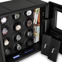 an open watch box with twelve watches in it's display case and money inside