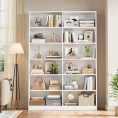 a living room filled with lots of furniture and bookshelves next to a window