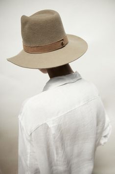 Design Our classic packable hat shape in clay wool with a tonal beige suede band. The flattering and neutral color for all shades of skin and hair. This hat is made from packable wool which means you can easily pack it away in your luggage or bag wherever you may go. This is a staple hat to any wardrobe. Material Our packable wool is sustainable and cruelty-free. We clean, scour and dye our wool in our employee-owned factory right here in the United States. From shearing the wool, to hand polish Elegant Solid Fedora For Everyday Wear, Classic Wide Brim Felt Hat For Everyday, Classic Felt Hat For Everyday Fall Wear, Classic Felt Hat For Fall, Classic Brimmed Felt Hat For Everyday, Modern Wide Brim Fedora For Everyday, Modern Fedora With Short Brim For Everyday, Classic Leather Fedora With Flat Brim, Leather Brimmed Fedora For Everyday Wear