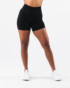 HIGHLIGHTS. High-waisted short 3-tiered tapered waistband Seamless knit fabric No front seam Back scrunch seam detail to enhance curves New leg and glute contouring panels FIT SUGGESTION. This item runs true to Alphalete's standard seamless fit.. We recommend sizing up for a comfortable fit.. Model is 5’7”/170cm, wearing a size M with 40"/101.6cm hips and 27.5”/69.8cm waist. MATERIALS AND WASHING DIRECTIONS. 51% Polyamide, 38% Polyester, 11% Elastane. We recommend washing inside-out on a cold se Compressive Hip-length Activewear With Wide Waistband, Seamless Fitted Athleisure Biker Shorts, Black Seamless Activewear With Built-in Shorts, Seamless Compression Athleisure Bottoms, Compression Athleisure Bottoms With Seamless Construction, Versatile Fitted Activewear With Contoured Waistband, Seamless Fitted Biker Shorts For Sportswear, Seamless Elastane Running Bottoms, Seamless Compression Sportswear Bottoms