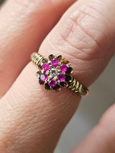 Ruby & Diamond 14K Ring Vintage Women Ruby Flower Ring Size 5.5 Vintage 14K ruby & diamond flower design ring in a very pretty wedding cake setting.  In great, ready to love condition.  Not marked but tests as 14k. Diamond & rubies are natural, mined gemstones.  Currently a size 5.5. 14k Stamped Flower Ring For Anniversary, Antique 14k Stamped Ruby Wedding Ring, Ruby Birthstone Ring Stamped 14k For Wedding, Wedding Ruby Birthstone Ring Stamped 14k, Ruby Cluster Ring With Rose Cut Diamonds For Anniversary, Round 14k Stamped Gold Flower Ring For Anniversary, Yellow Gold Flower Ring With 17 Jewels For Anniversary, Gold Cluster Ruby Ring For Wedding, Yellow Gold Ruby Flower Ring For Anniversary