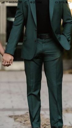 Green Dress Outfit Men, Men’s Prom Outfit Green, Green Tucks For Men, Black And Dark Green Suit Men, Dark Green Prom Suits For Men, Deep Green Suits For Men, Deep Green Mens Suit Wedding, Dark Forest Green Tuxedo, Evergreen Suit Men