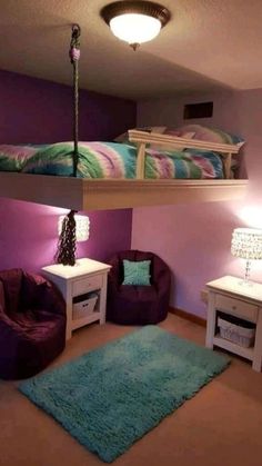 a room with two beds and purple walls, one has a green rug on the floor