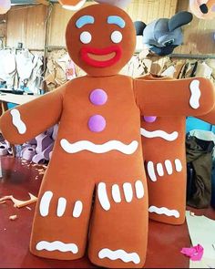 a large ginger man made out of paper mache