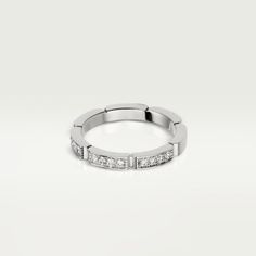 a white gold wedding band with princess cut diamonds on the sides and channel set shoulders