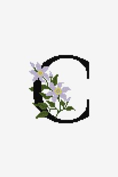 the letter c is decorated with flowers on it's side and sits in front of a white background