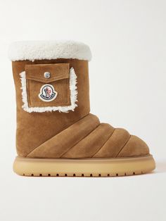 Whether you're at the lodge or braving wintry weather back home, Moncler's 'Gaia' boots are sure to keep you comfortable and warm. Made from suede, they're quilted for extra comfort and have insulating shearling trims and lining. The side pockets are perfect for storing small essentials like your keys and lip balm. Outdoor Insulated Shearling Boots, Brown Shearling Boots With Rubber Sole, Luxury Brown Shearling Boots, Shearling Lace-up Winter Boots, Shearling Lace-up Boots For Outdoor, Cinch Bag, Moncler Women, Shoes Boots Ankle, Raffia Bag