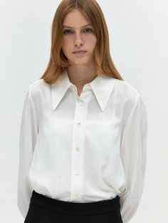 Editor's NotesThis blouse features a romantic design with a soft fit. It is a good item to create a lovely mood with a big collar and delicate shirring on the sleeves.- Attractive texture with natural wrinkle processing- Luxurious logo mother-of-pearl button- Sleeves that can be opened and closed*The color of the product may differ from the actual color depending on the resolution of your monitor.Measurements(in.)ONE SIZE (XS-M)- Length: 26.38 in.- Shoulder: 15.35 in.- Chest: 20.87 in.- Sleeve length: 24.41 in.- Sleeve opening: 4.33 in.*Model size: Height 5'68, Bust 24, Waist 19, Hip 27*Size measurement is based on cross-section, and an error of 0.39 to 1.18 inch may occur depending on the measurement method and location.Composition & Care- 62% Rayon, 38% Nylon- Due to the nature of th Elegant Workwear Shirt With Ruffled Collar, Classic Formal Blouse With Collared Neckline, Feminine Workwear Blouse With Spread Collar, Spring Daywear Blouse With Fold Down Collar, Feminine Blouse With Spread Collar For Work, Elegant Collared Shirt With Blouson Sleeves, Formal Collared Blouse With Blouson Sleeves, Chic Blouse With Lapel Collar For Daywear, Elegant Shirt With Blouson Sleeves And Collar