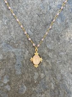 This vintage-inspired necklace is handmade using a 2mm genuine rose quartz wire-wrapped chain and a 12x17mm pendant with an authentic 6x8mm rose quartz stone.  This necklace is hypoallergenic. (Cadium free, lead free, and nickel safe)  Rose quartz is a gemstone that promotes love and emotional healing. Please note that each stone is unique and varies in color. The necklace comes in a ribbon-wrapped box and is ready to be gifted. If you would like to leave a note for the recipient, you can do so Gold Bohemian Rose Quartz Necklace, Handmade Gold Crystal Necklace With Rose Quartz, Gold Wire Wrapped Rose Quartz Jewelry, Gold Rose Quartz Wire Wrapped Necklace, Gold Wire Wrapped Rose Quartz Necklace, Gold Wire-wrapped Rose Quartz Necklace, Wire Wrapped Chain, Rose Gold Quartz, Who Is She