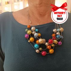 "A multi-stranded necklace with a broad spectrum of vibrant and vivid colors, a statement necklace, and in an eye-catching style. This necklace will decorate any dress or shirt for any occasion. ❃ SIZE ❃ Necklace Length: From 17'' (42cm) - To 23.6\" (60cm) Custom Size Extension Length: 2'' (5cm) ❃ MATERIAL ❃ Colored Beads: Chip-Proof Anodized Aluminum Lobster or Spring Lock Closure: 925 Sterling Silver Extension: Sterling Silver Wire: Coated cable ❃ Please note, colors may look different dependi Colorful Round Beads Necklaces For Party, Rainbow Beaded Necklaces For Party, Multicolor Beaded Jewelry For Parties, Eye-catching Multicolor Party Jewelry, Colorful Round Beads Beaded Necklaces For Party, Colorful Round Beads Necklace For Party, Unique Multicolor Beaded Necklaces For Celebrations, Party Multicolor Necklaces With Large Beads, Festive Multicolor Round Beads Necklaces