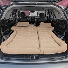 the interior of an suv with two seats folded out on it's back end