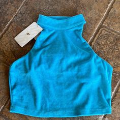 Terri Cloth Cropped Length Racer Back Mock Neck New! Blue Crop Top For Sports In Spring, Blue Sports Crop Top For Spring, Trendy Blue Crop Top For Workout, Casual Blue Crop Top For Yoga, Blue Athleisure Crop Top For Summer, Blue Casual Crop Top For Gym, Blue Cropped Activewear For Summer, Trendy Blue Sports Crop Top, Blue Crop Top Activewear For Sports