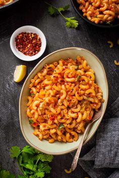 a bowl filled with macaroni and cheese on top of a table