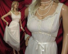 Vintage full length nightgown in off white color , double layer with nylon chiffon overlay and soft nylon underneath .  With stunning low lace bodice  with tie up satin  ribbon under the bust , and low cut back with lace trim and has a full swing skirt .   Made by ''HILTON''  for Van Raalte lingerie   Tag reads size W  and would be a modern size   32(USA)  size   12(AU) White Lace Trim Party Nightgown, Sheer V-neck Nightgown For Wedding Night, Coquette V-neck Nightgown With Lace Trim, Party Nightgown With Lace Trim, Sleeveless, White Nightgown Plus. 2x, Chiffon Overlay, Lace Bodice, Off White Color, Petticoat