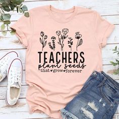 If you are looking for the perfect adorable Bella and Canvas Teachers Plant Seeds, Teacher T Shirt, Christian Teacher Shirt, Christian Teacher Tee, Elementary Teacher, or Middle School Teacher tee you've come to the right place.  This super soft Bella and Canvas Mama shirt is perfect for almost any occasion. It comes in 12 different colors. Design is printed in black on the following colors: White, Ash, Heather Mauve, Natural, Heather Ice Blue, Pink, Charity Pink, and Heather Peach. Design is pr Casual Tops With Funny Print For Teacher Appreciation, Cute Tops With Name Print For Teacher Appreciation, Casual Summer Tops For Teacher Appreciation, Teacher Appreciation Shirts, Teacher Middle School, Teacher Inspiration, Plant Seeds, Middle School Teachers, Teacher Tees