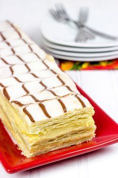 a piece of cake sitting on top of a red plate