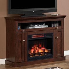 an entertainment center with a fireplace and television