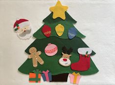 a felt christmas tree with decorations on it