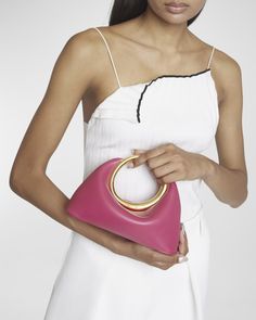 Jacquemus "Le Petit Calino" top handle bag in leather     Metal ring clasp top handle    Open top with magnetic closure     Lining: Cotton    Approx. 8.3"H x 12.9"W x 4.9"D    Made in Italy Mini Handbags, Metal Ring, Open Top, French Design, Handle Bag, Cotton Totes, Metal Rings, Magnetic Closure, Dark Pink