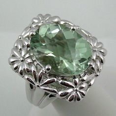 ***********Price Is Firm - Final Sale************ Victoria Wieck 6.5ct Prasiolite Floral Design Sterling Silver Ring. Oval Prasiolite (16x12mm) With Checkerboard-Cut Top Is Prong-Set At The Center Of The Floral Design Frame. Ring Measures Approx. 14/16" Long X 13/16" Wide. Tri-Split Shoulders .925 Sterling Silver Boxed Elegant Green Oval Amethyst Ring, Elegant Green Amethyst Ring For Formal Occasions, Elegant Green Amethyst Ring With Accent Stones, Formal Green Amethyst Ring With Accent Stones, Elegant Green Amethyst Ring In Sterling Silver, Formal Green Amethyst Ring With Gemstone Accents, Green Amethyst Ring For Formal Occasions, Elegant Silver Green Amethyst Ring, Elegant Green Amethyst Ring For Anniversary