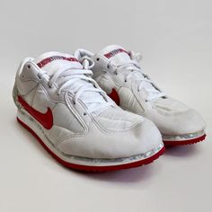 "Offered are a pair of deadstock NIKE \"Niobe\" sneakers. They come with their original box and would have been released in the mid 1990s, as part of Nike's running/ jogging/ fitness drive. Condition - Year Made: 1994 - Color: white/atom red-grey mist - Brand: Nike - Size: 11.5 - These shoes are deadstock - Original box - Evidence of storage wear - Due to age, this shoe may not be suitable for wear." 90s White Sports Sneakers, Vintage Sneakers With Rubber Waffle Outsoles For Jogging, Retro High-top Running Shoes, 90s Low-top Sports Sneakers, Vintage Low-top Running Sneakers, Retro High-top Running Shoes For Sports, Vintage Custom Sneakers With Round Toe For Sports, Vintage White Custom Sneakers For Sports, Vintage Style Custom Lace-up Sneakers For Sports