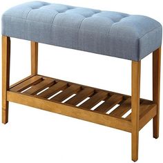 a wooden bench with a blue upholstered cushion on it's top shelf