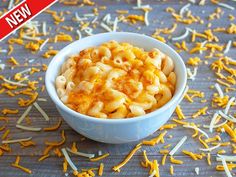 a bowl filled with macaroni and cheese on top of a table